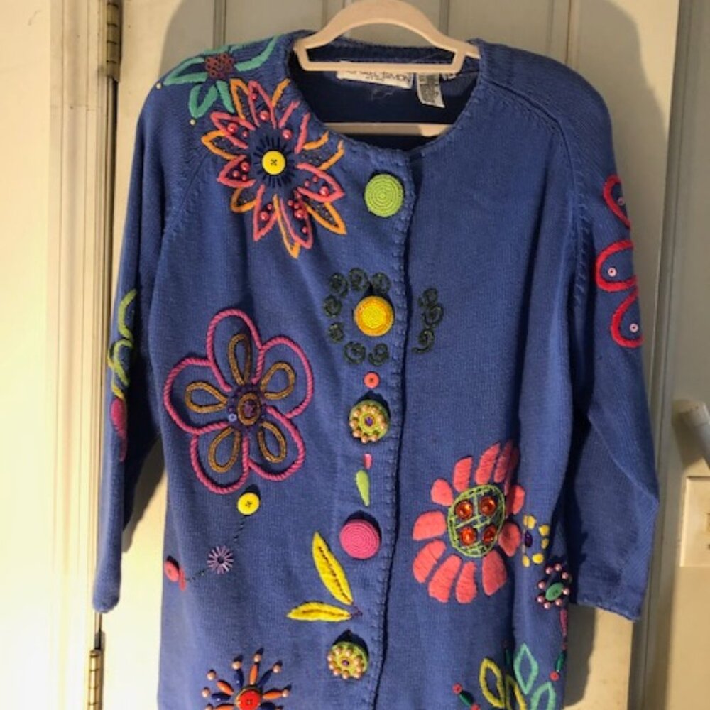 This Michael Simon NY vintage cardigan is a unique piece featuring 1950s car app